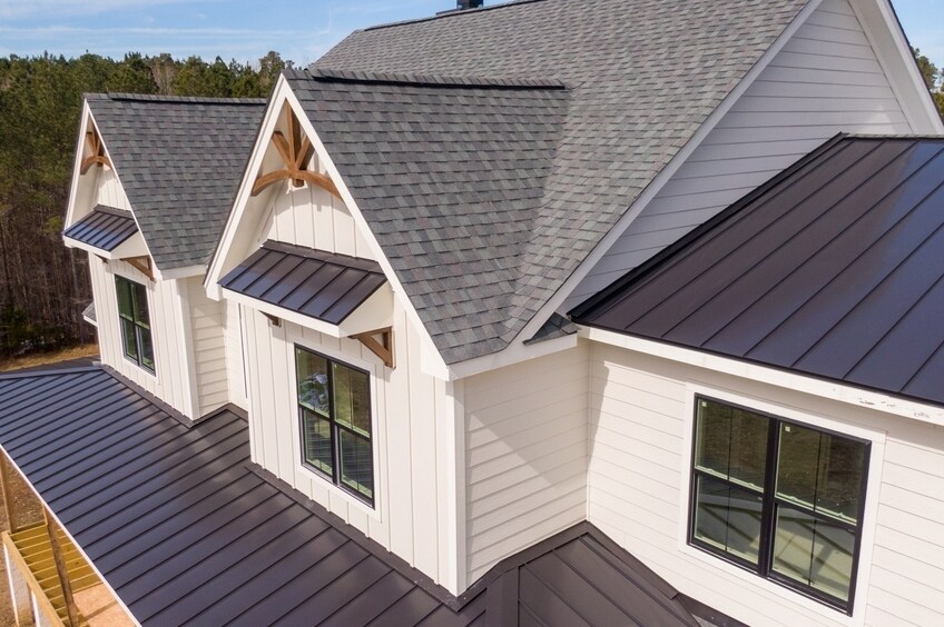 Sunny Daytime Drone Images of a Custom Home in the Final Stages of Construction. It Features a Roof 